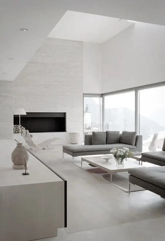 a minimalist space done with much negative space and filled with light for an airy feeling, natural light coming through the wall makes the space airier