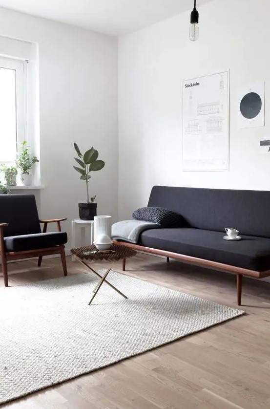 a Scandinavian living room with a blank space that brings a comfortable feeling to the room and makes it very airy and light