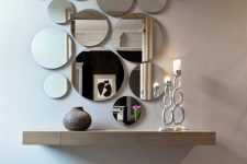 05 an arrangement of round mirrors of various sizes and a floating vanity for an ethereal look