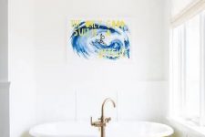 07 a catchy bathroom with a black and white printed floor, a yellow clawfoot tub, a bold artwork and a statement fixture is wow
