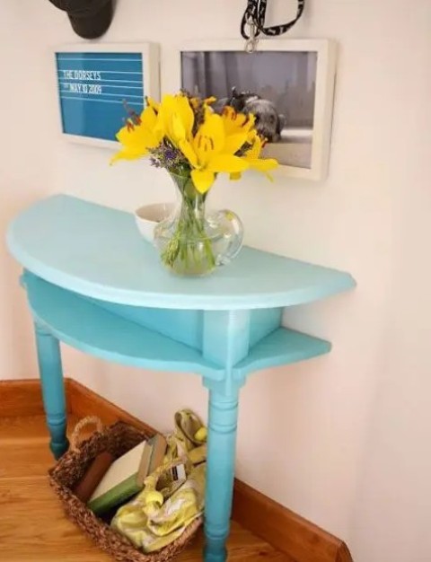 a half cut table painted bold is the best idea for a small entryway where you need a console and it will add a touch of color to the space