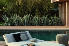07 a modern oudoor daybed with an arrangement of pillows, a pouf is a great idea for a pool zone or just to relax somewhere outdoors
