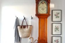 09 a large grandfather’s clock is a show-stopper in a rustic entryway, when it gets a bit worn, you may just restain or repaint the piece