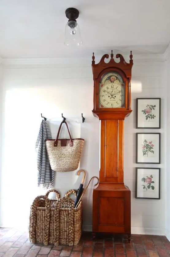 a large grandfather's clock is a show-stopper in a rustic entryway, when it gets a bit worn, you may just restain or repaint the piece