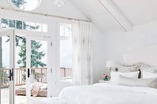 13 an airy and elegant bedroom with much negative space for an airy and natural feeling and lots of natural light