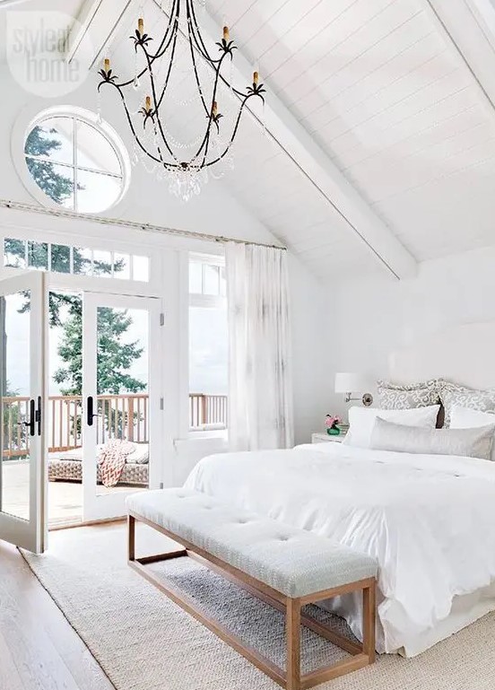 an airy and elegant bedroom with much negative space for an airy and natural feeling and lots of natural light