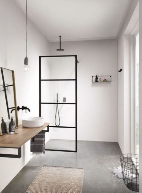 a neutral Scandi bathroom with black touches for drama, with wood and a jute rug plus a wire basket