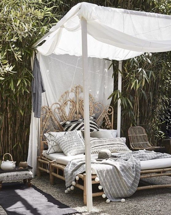 an exquisite carved wooden daybed with a canopy is amazing for a tropical or boho retreat