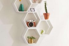 15 hexagon-shaped wall-mounted shelves are great for a mid-century modern space, they allow you display some stuff