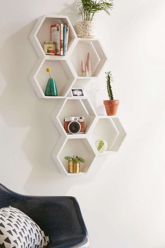 hexagon shaped wall mounted shelves are great for a mid century modern space, they allow you display some stuff