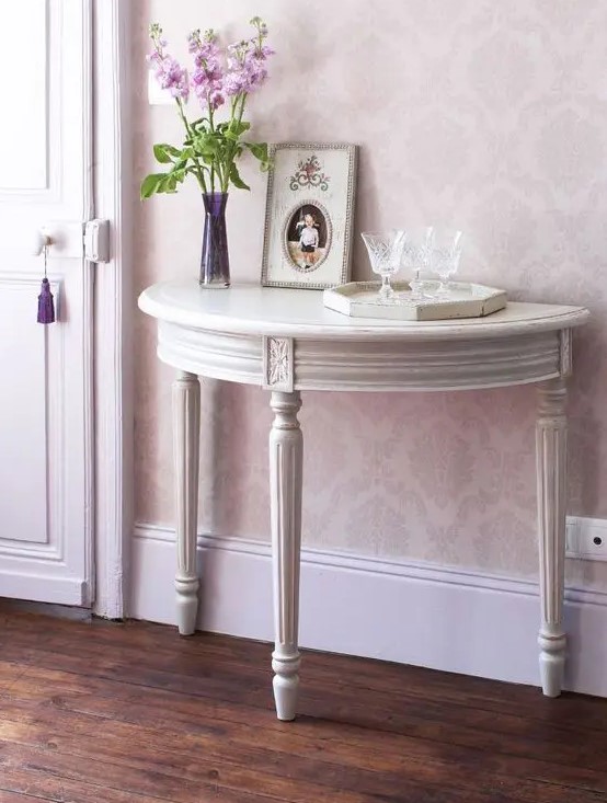 a vintage grey console half table with elegant legs will add a refined touch to your space and will hold some pieces