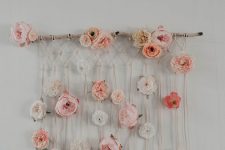 20 a boho macrame wall hanging with pastel faux blooms is a beautiful decoration for a free-spirited space