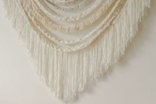 21 a neutral large scale braided wall hanging with long fringe is a great idea for a boho touch in the space