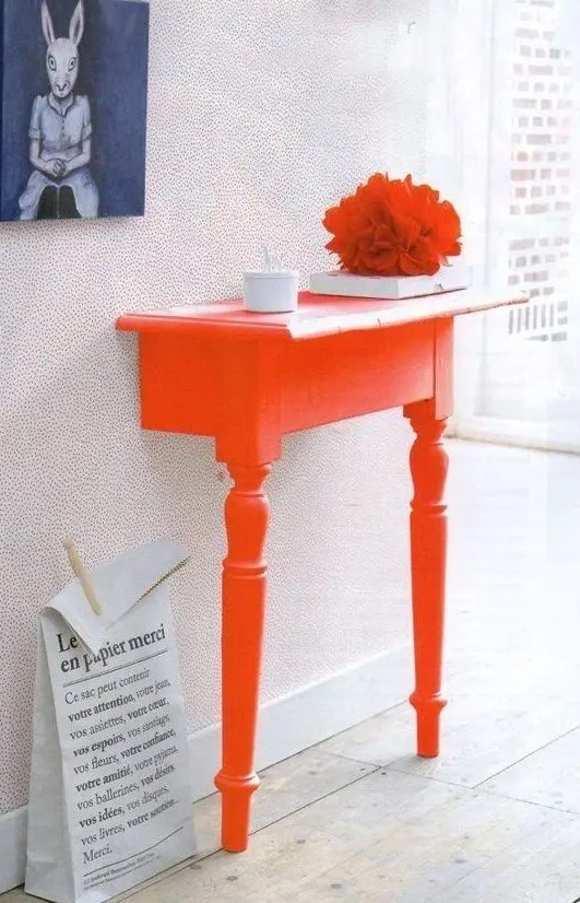 chop a table in half to make the ultimate space-saving entryway table and then paint it bold to add color to the space