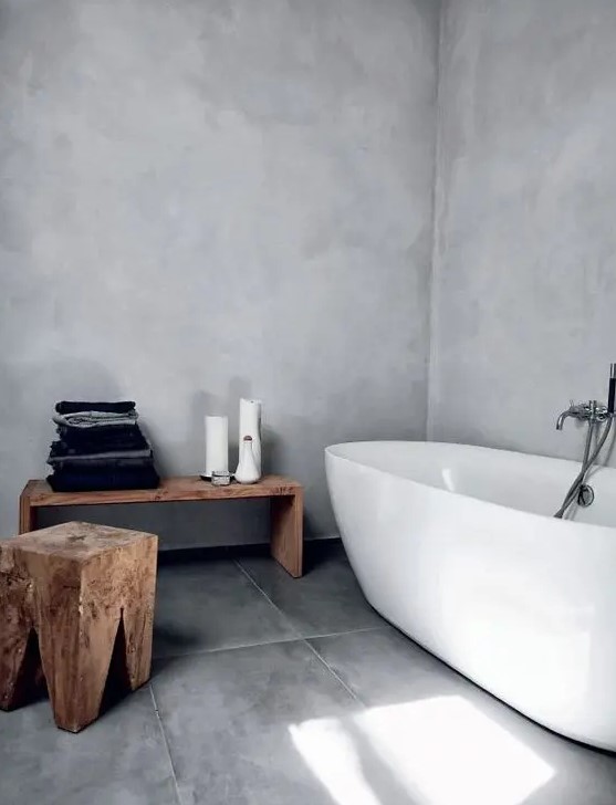a minimalist space like this bathroom feels bigger with negative space, and decluttering it helps a lot with that