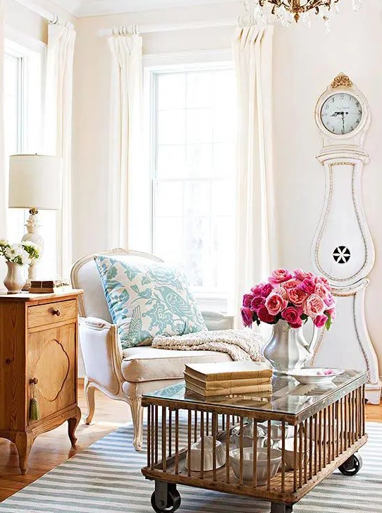 a shaby chic neutral living room with a refined flavor and a gorgeous white and gold grandfather's clock