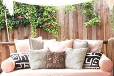 a diy pallet daybed for an outdoor oasis