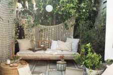 25 a rattan outdoor daybed under a tree to avoid much sunshine is a perfect fit for a neutral boho zone