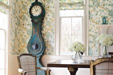 a lovely botanical wallpaper makes this dining space quite vintage
