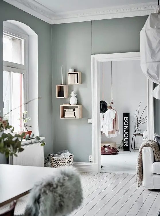 a Scandinavian space spruced up with pale green looks unusual and very catchy, lots of natural light is a traditional feature of such spaces