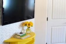 26 a comfy TV console of a half cut table painted bold yellow will provide some storage without taking much space
