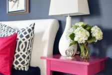 27 a nightstand made of a cut table and painted hot pink to make a perfect fit for the space, to add color and not to take much space
