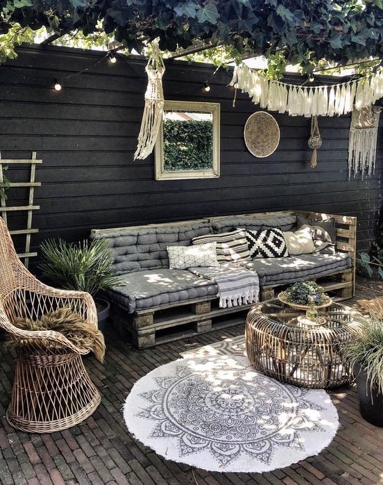 a pallet daybed can be DIYed, and you may add printed pillows and blankets - it's a fit for many spaces including this boho one