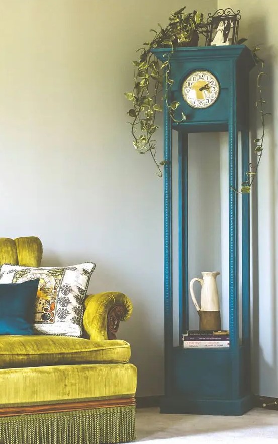paint the clock in a bold shade, for example, teal, and use the lower part as a shelf, and make a statement with its color