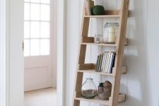 36 a leaning wall shelf – a ladder for storage is a brialliant idea for a rustic or farmhouse home