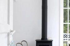43 such a modern looking black firewood stove is another fresh idea to substitute a traditional Scandinavian stove