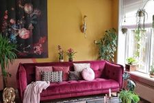 a living room with an yellow accent wall