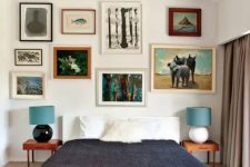 a colorful mid-century modern bedroom with a bright geometric rug, a bed, laconic nightstands and an eclectic gallery wall