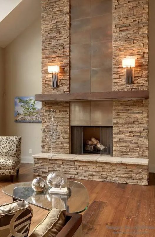 a faux stone clad fireplace with metal incorporated is ideal for a modern rustic living room