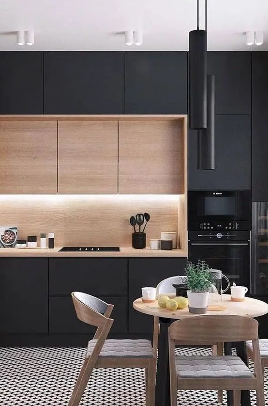 a black kitchen mixed with wood