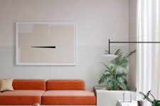 a stylish minimalist living room design with an orange sofa