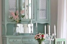 a mint vintage cupboard with mirror parts and tulle curtains inside the compartments will fit a vintage or a shabby chic space easily