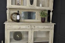 a pastel shabby chic cupboard with chicken wire instead of glass is a simple DIY project that doesn’t require much money or time and looks very cool