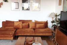 a stylish room with an orange IKEA sofa