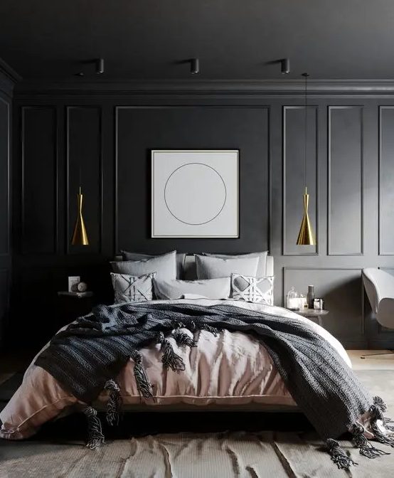 a refined slate grey bedroom with paneling, gold pendant lamps, a bed with grey and pink bedding and an artwork