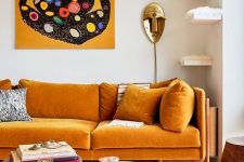 an exquisite living room with a honey yellow sofa, floating shelves for cats, round wooden tables and a bold artwork