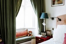 an upholstered window sill is a nice idea of a seat in your bedroom that saves some space