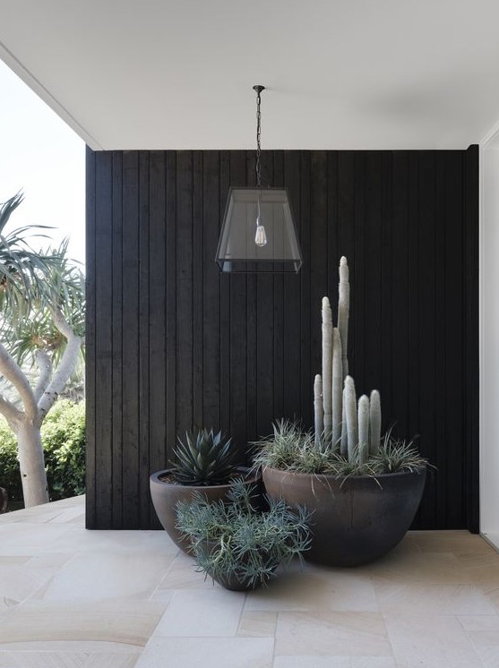 a modern front porch with stylish planters