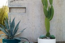 cup-like planters of various colors and sizes compose a chic modern arrangement that you can rock