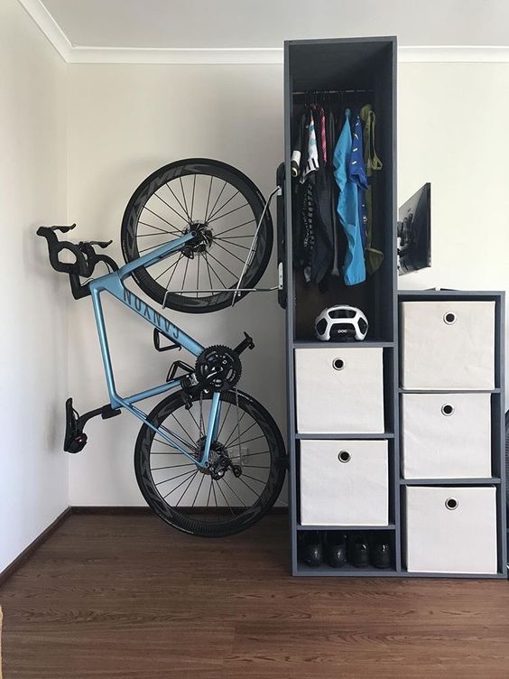 a bike rack attached to a storage unit is a smart idea to show off your bike and to store it inside your home