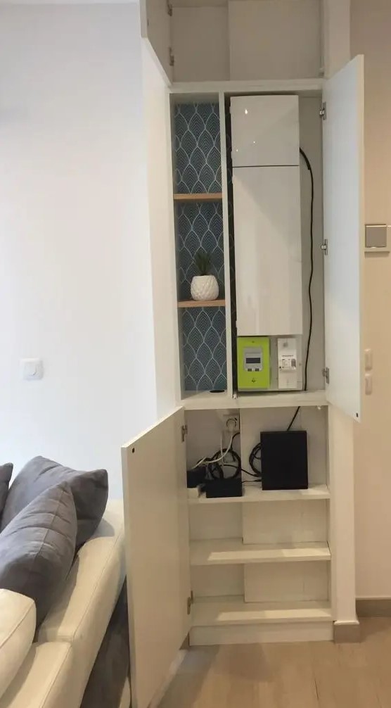 a built-in storage cabinet with shelves and storage units can hide a wi-fi router or some other stuff and declutter your space