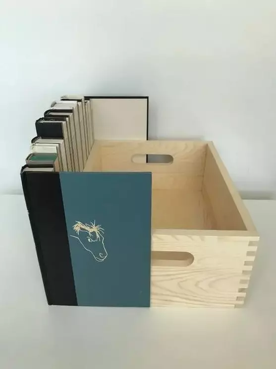 a crate with faux books attached to it can hide any electronics you want to hide, and will do it with elegance