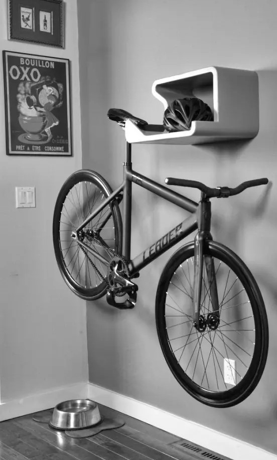 a sleek contemporary shelf for storing a helmet and a bike is a pretty idea for a contemporary entryway or some other space