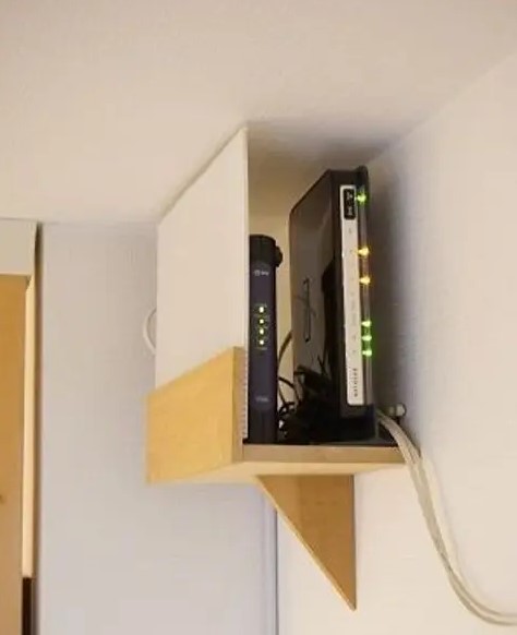 a mini shelf attached right under the ceiling will elegantly hide your router and will merge with the color of the walls and ceiling