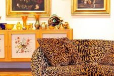 18 a bold vintage living room with a leopard print sofa, a red rug, a chic painted credenza, dark and moody art is amazing