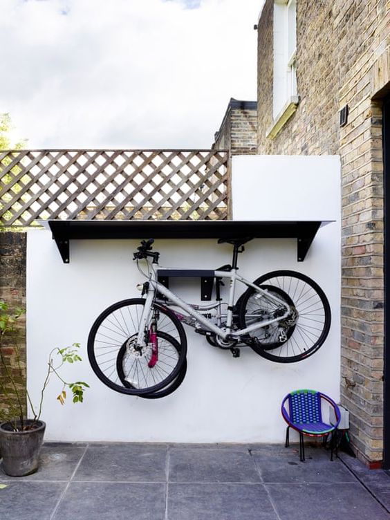 an outdoor shelf and an additional shelf to store your bikes outdoors   this idea can be applied to indoors, too